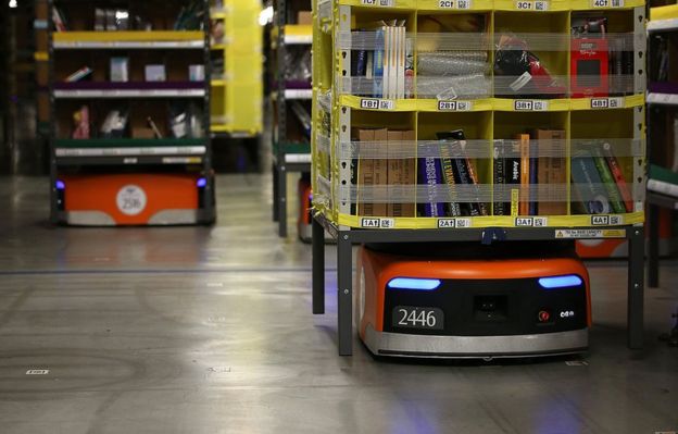 Kiva robots move racks of merchandise around an Amazon warehouse