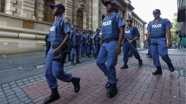 South African police officers outside the KwaZulu-Natal High Court in Durban.