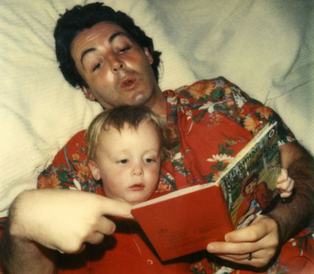 Paul McCartney reading to his son James