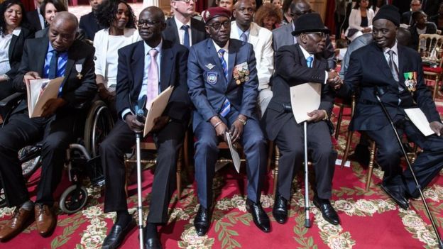 African war veterans at a citizenship ceremony in France