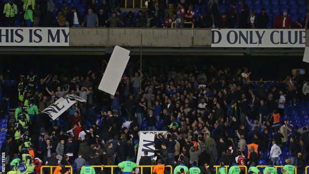 Fans tear down Tottenham banners