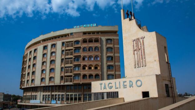 Futurist architecture of the FIAT tagliero service station built in 1938 in front of nakfa house, Central region, Asmara, Eritrea on August 22, 2019 in Asmara, Eritrea