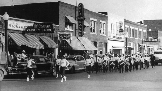 A marching band in the streets of Greenwood, prior to 21 June 1921