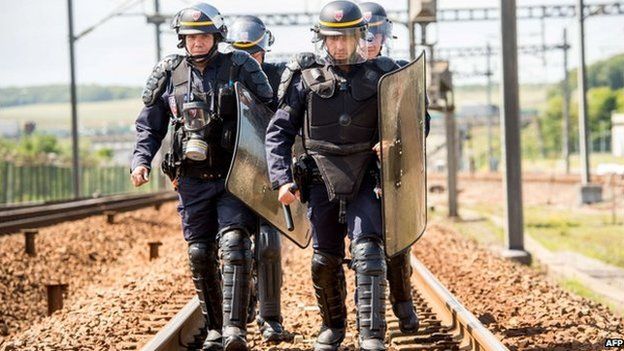 French riot police on a train line