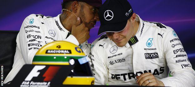 Lewis Hamilton and Valtteri Bottas share a word in the press conference