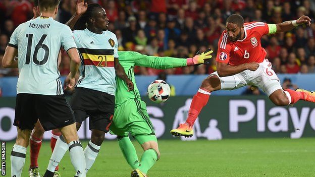 Ashley Williams has an effort on goal (not his goal) against Belgium at Euro 2016.
