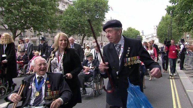 Man dances as veterans make their way down Whitehall