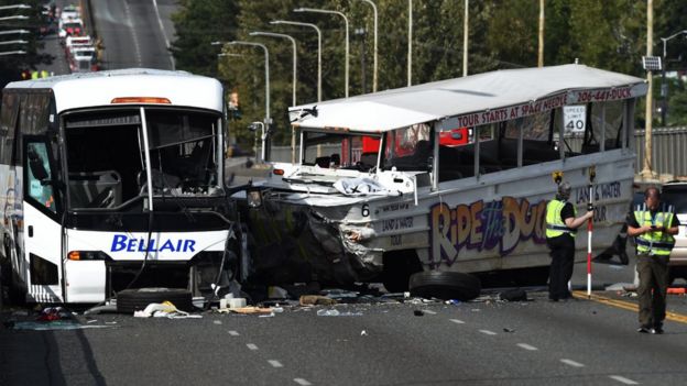 The scene of a fatal crash between a tour bus and a tourist duck boat on the Aurora Bridge in Seattle, Washington, 24 September 2015. At least four people were killed and several were critically injured when a bus collided with a tour vehicle on a bridge in the US West Coast city of Seattle, officials said.