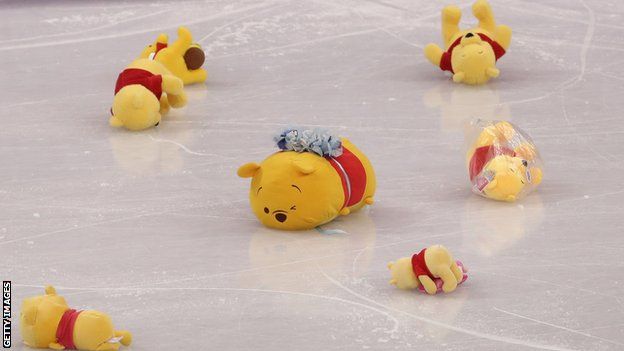 Winnie the Pooh toys on the ice