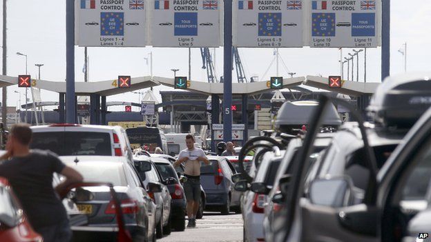 Ferry passengers heading to England line up at the car ferry terminal in Calais