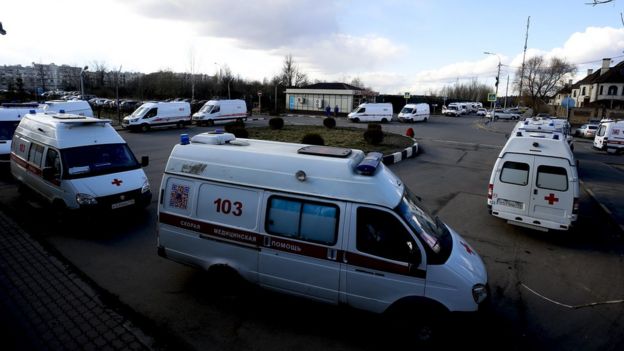 Ambulance vehicles queue at the entrance to a medical clinic in Moscow