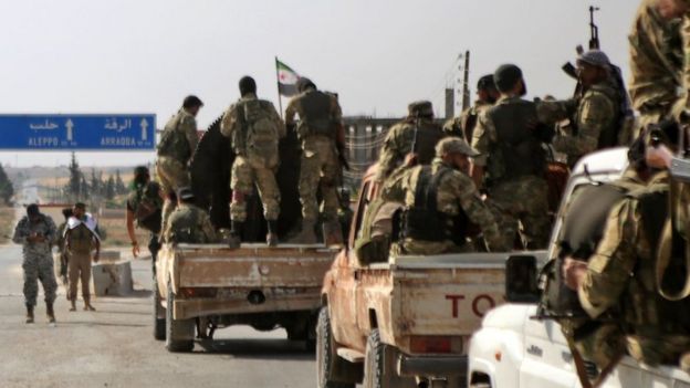 Turkish-backed Syrian fighters are pictured in the town of Ayn al-Arus