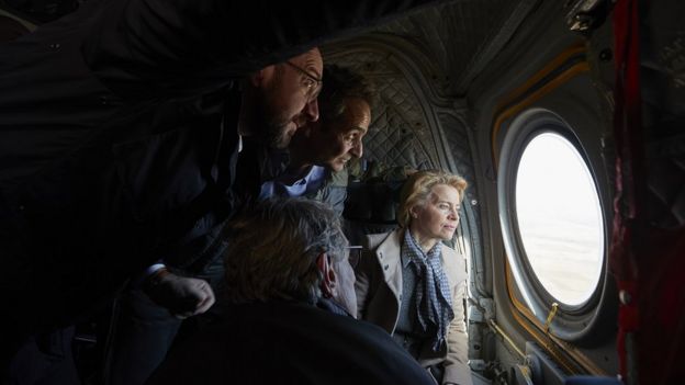 Greek Prime Minister Kyriakos Mitsotakis (2-L) with European Council President Charles Michel (L), European Commission President Ursula von der Leyen (R) and European Parliament President David Sassoli (bottom, back to camera), looking out of the window of a helicopter during a flight over Evros, at the Greek-Turkish border in northern Greece, 03 March 2020
