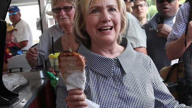 Hilary Clinton eating pork chop on a stick