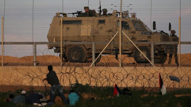 Israeli troops take position during a Palestinian protest at the Gaza-Israel border fence in the southern Gaza Strip on 18 January 2019