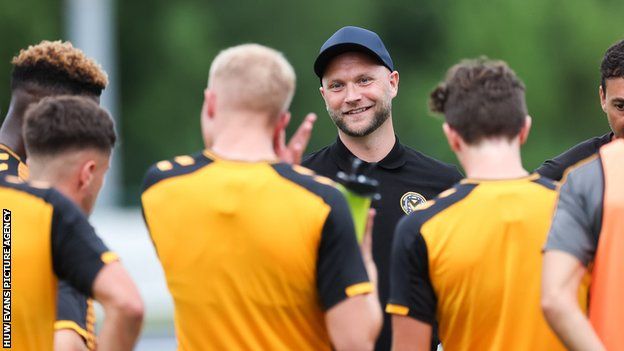 James Rowberry talks with the Newport County players