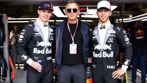 James Bond (actor Daniel Craig) and the then-Red Bull pairing of Max Verstappen and Pierre Gasly in their race suit 'tuxedos' at last year's British Grand Prix
