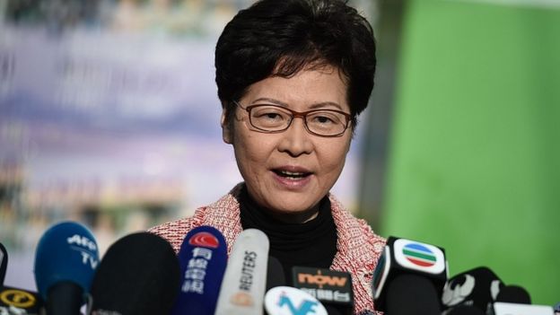 Hong Kong Chief Executive Carrie Lam speaks to the press after casting her vote during the district council elections in Hong Kong on November 24, 2019