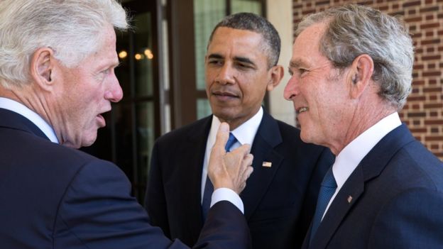 Bill Clinton, Barack Obama and George W Bush in discussion at a event in April 2013