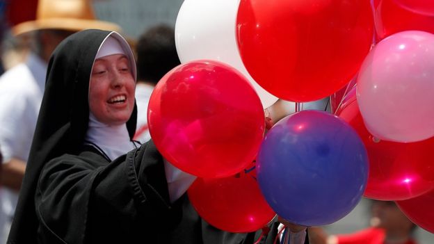 Traditional Catholic nun Sister Mary Augustin hands out red, white and blue balloons during a Fourth of July parade and celebration at the Motherhouse of the Daughters of Mary Convent in Round Top, New York, USA, 04 July 2017