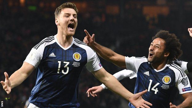 Chris Martin celebrates scoring Scotland's late winner against Slovenia