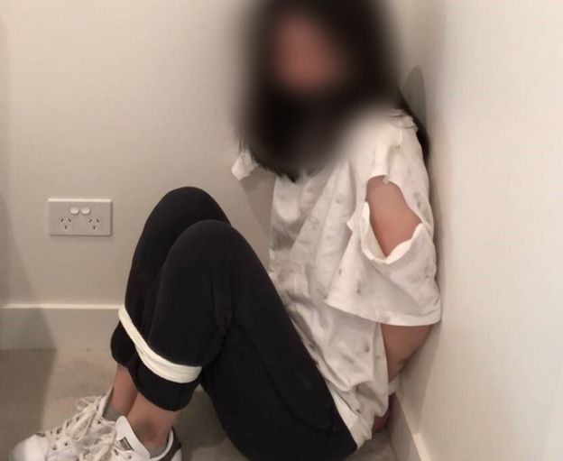 Police-supplied image of a woman wearing a ripped shirt bound in a staged kidnap