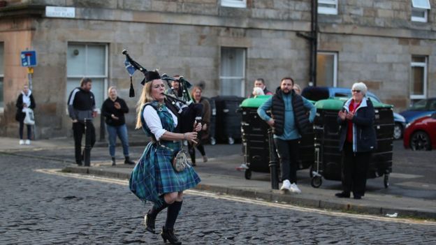Bagpiper Louise Marshall performs in Leith, Edinburgh