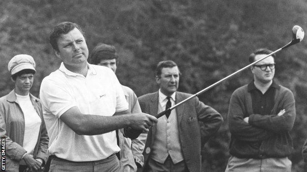 Peter Alliss tees off in a competition, watched by several people