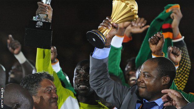 Kalusha Bwalya (right) lifts the Africa Cup of Nations trophy in 2012