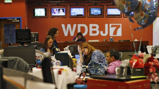 Colleagues of Adam Ward and Alison Parker at WDBJ - shown at their desks