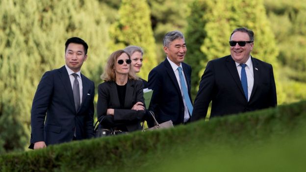 Deputy Assistant Secretary for the Bureau of East Asian and Pacific Affairs Alex Wong, aide Lisa Kenna, NSC Korea Director Allison Hooker, US Ambassador to the Philippines Sung Kim, and Secretary of State Mike Pompeo walk back into the Park Hwa Guest House