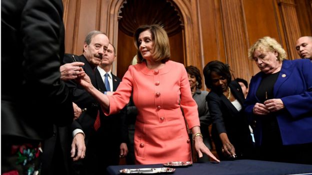 Pelosi hands out commemorative pens