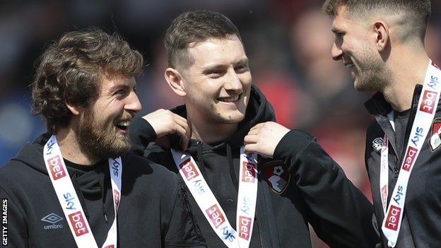 David Brooks (centre) celebrates Bournemouth's promotion to the Premier League with Wales team-mate Chris Mepham (right) and Ben Pearson