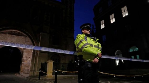 Police officers secure a police cordon near Forbury Gardens park in Reading, west of London