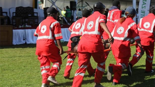 Members of the Zimbabwe Red Cross Society (ZRCS) carry an injured member of the Zimbabwe National Army (ZNA), who was reportedly injured after a bomb went off at a rally addressed by President Emmerson Mnangagwa, at White City Stadium in Bulawayo, Zimbabwe, 23 June 2018