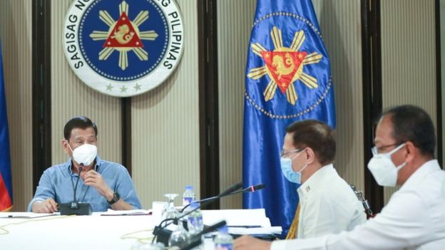Philippine President Rodrigo Duterte (L), Health Secretary Enrique Duque (R), and Carlito Galvez (C), chief implementer of the National Action Plan against COVID-19, listen over a meeting with members of the inter-Agency Task Force on the Emerging Infectious Diseases (IATF-EID) in Malacanang Palace in Manila on 8 April 2020