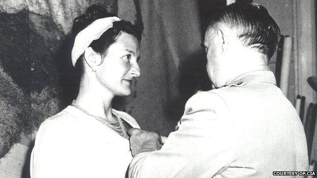 William Donovan, the creator of the OSS, pins a medal on Virginia Hall in a private ceremony in 1945