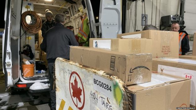Crafts getting ready to be loaded onto an Air Canada cargo plane