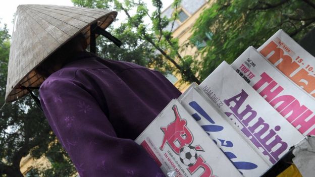 Newspaper vendor in Vietnam