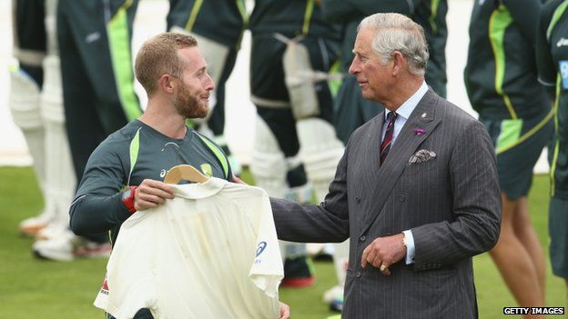 Team manager Gavin Dovey presents Prince Charles with an Australia shirt