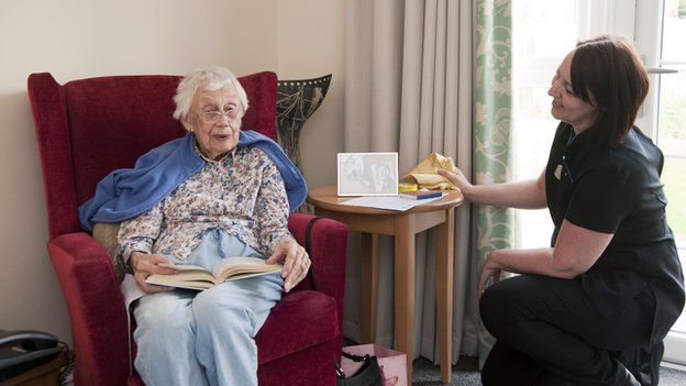 Care home resident with carer