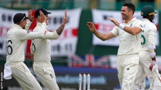 England bowler James Anderson (right) celebrates taking a wicket against South Africa in the second Test with Joe Root (far left) and Ben Stokes (left)