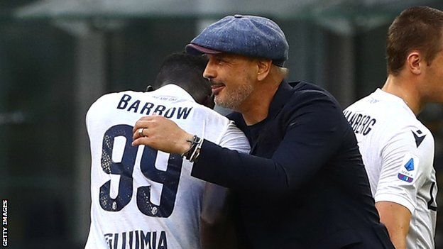 The Gambia's Musa Barrow hugs Bologna coach Sinisa Mihajlovic