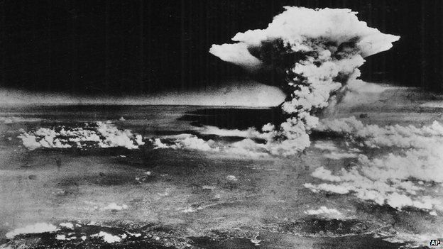 A plume of smoke from a mushroom cloud billows an hour after the nuclear bomb was detonated above Hiroshima, Japan on 6 August 1945