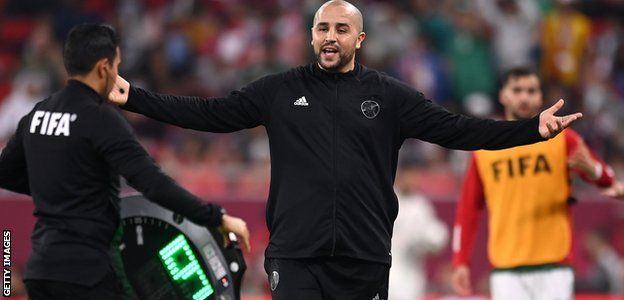Algeria coach Madjid Bougherra questions the fourth official over nine minutes of injury time