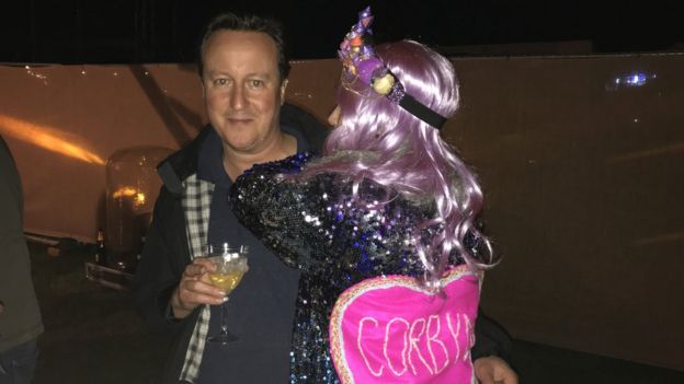 A festival revellers hugs David Cameron