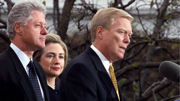 US President Bill Clinton (L) and First Lady Hillary (C) listen as US House Minority Leader Dick Gephardt (R) addresses the nation 19 December at the White House after the US House of Representatives impeached Clinton on charges of perjury and obstruction of justice