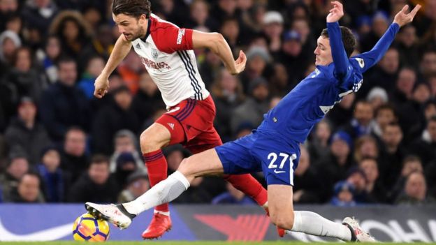 Andreas Christensen of Chelsea tackles Jay Rodriguez of West Bromwich Albion.