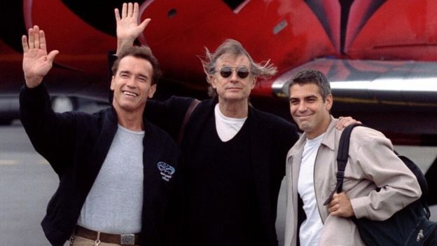 Schumacher, centre, with Arnold Schwarzenegger and George Clooney