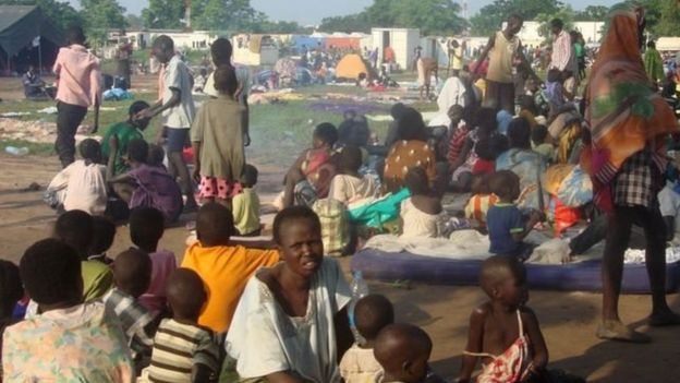 Displaced people taking shelter at a UN compound in Juba (UNMISS picture)Image copyrightAFP